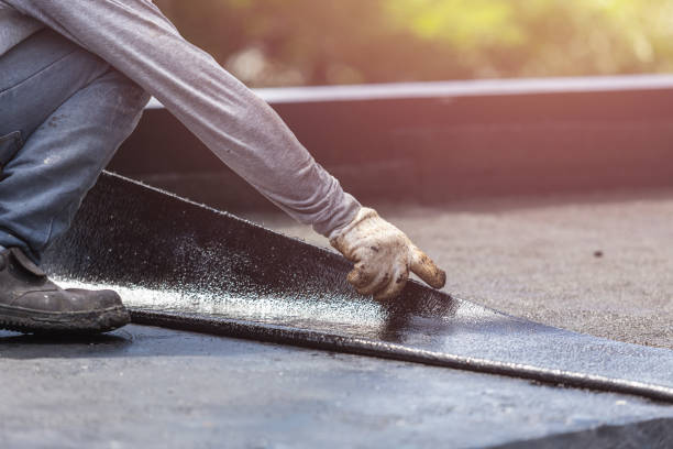 Professional Basement Waterproofing technician working in Lennon, MI